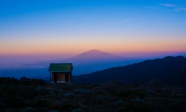 a small shack in a field