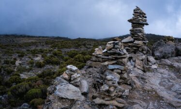 a rocky area with a stack of rocks on it