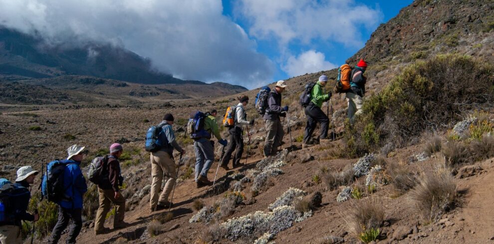 people hiking on mountain during daytime