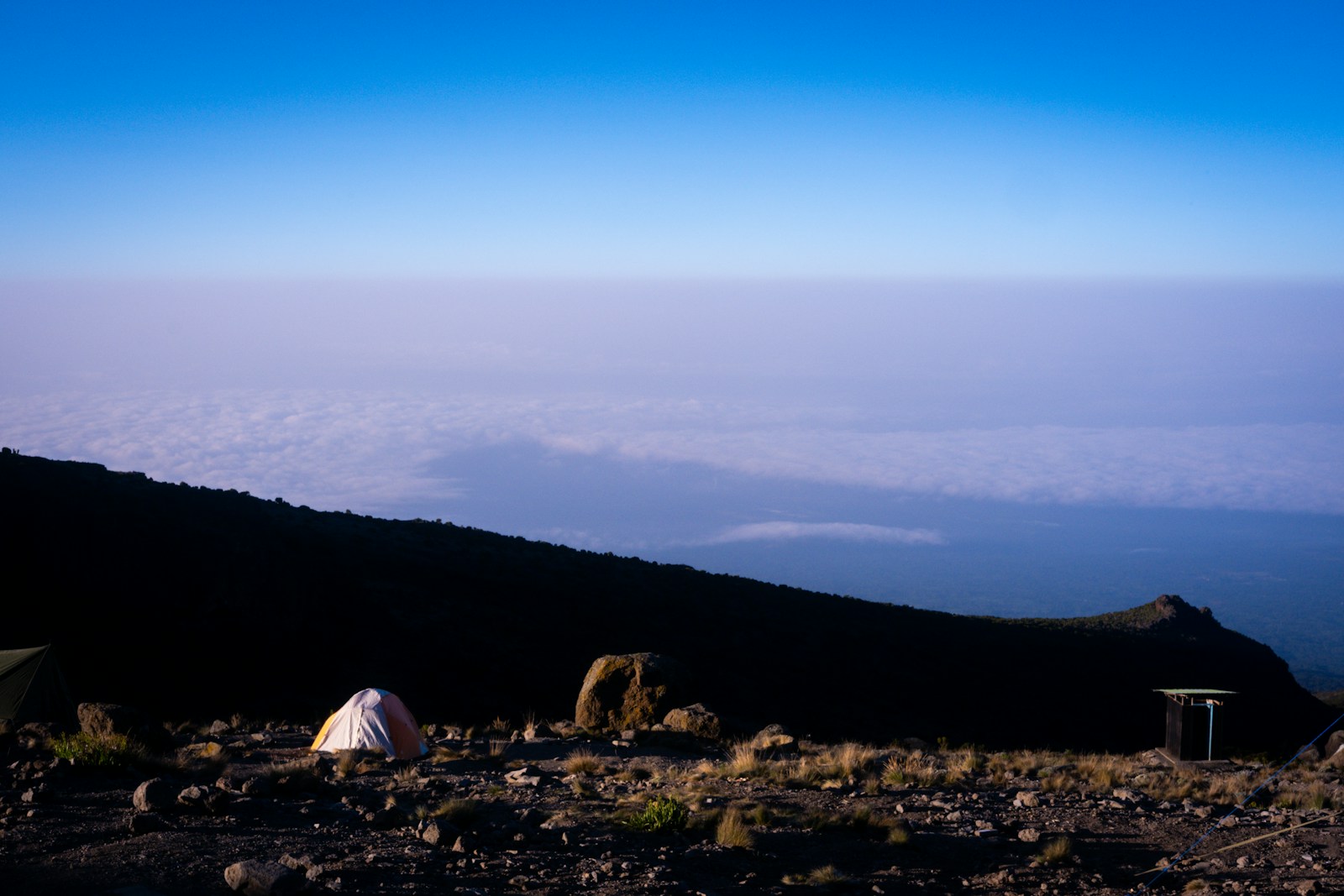 a tent in a rocky area