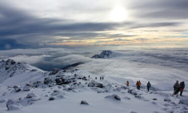 people on snow covered mountain during daytime